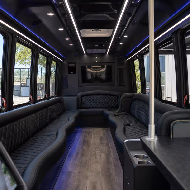 Friends laughing during a Omaha party bus celebration