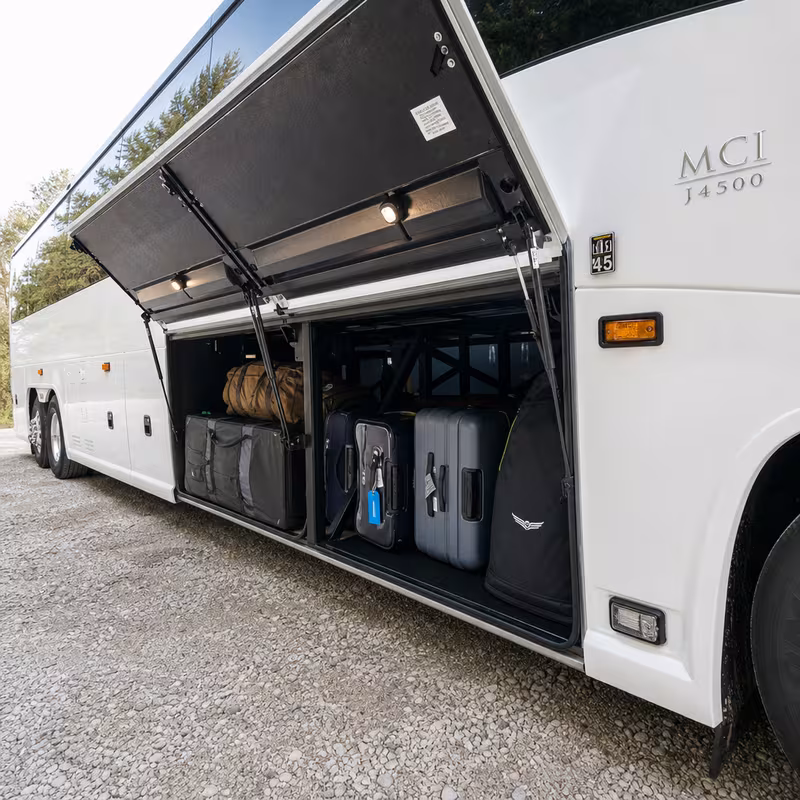 Party bus interior with wraparound leather seating and LED lighting in Omaha