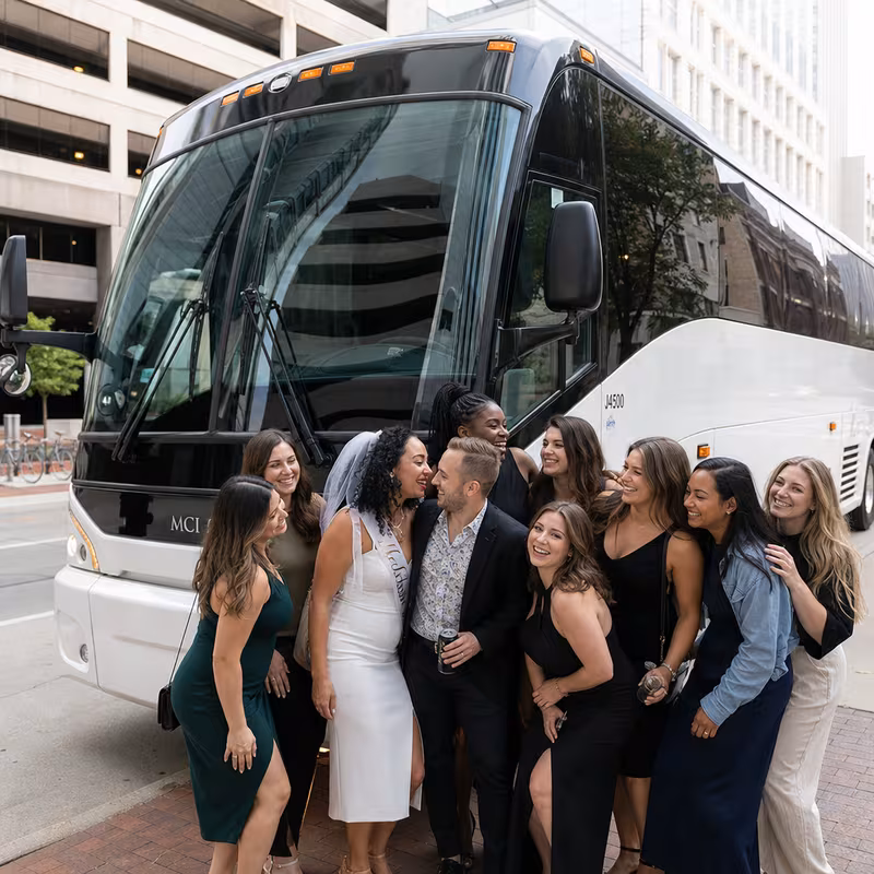 Passengers loading luggage while boarding an Omaha group shuttle