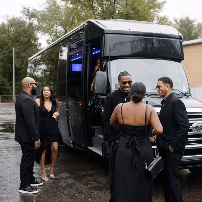 Passengers loading luggage while boarding an Omaha group shuttle