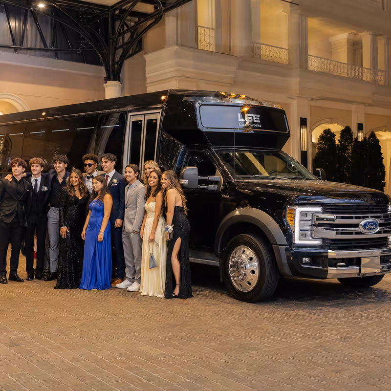 Party bus interior with wraparound leather seating and LED lighting in Omaha