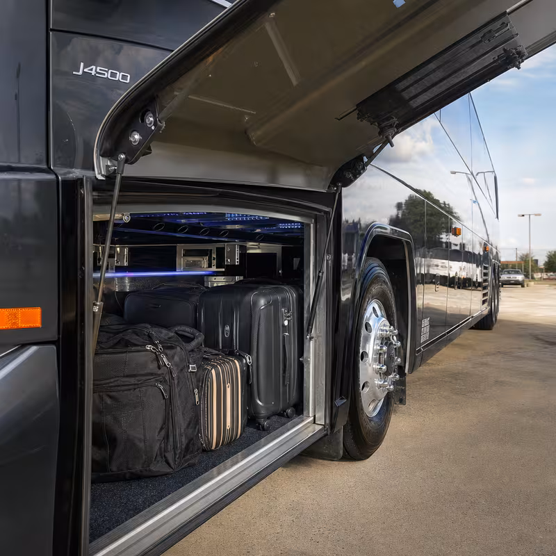 Party bus interior with wraparound leather seating and LED lighting in Omaha