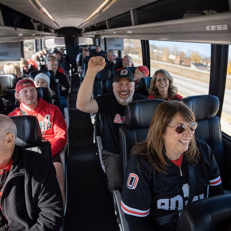Black Mercedes Sprinter van staged for an Omaha Sporting Event Transportation group