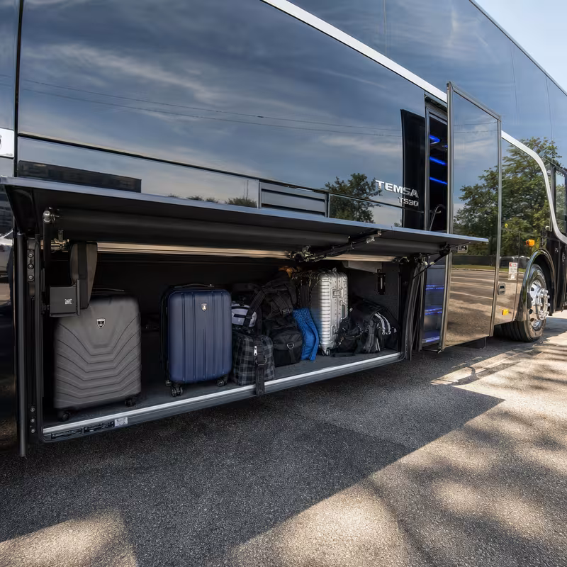 Party bus interior with wraparound leather seating and LED lighting in Omaha