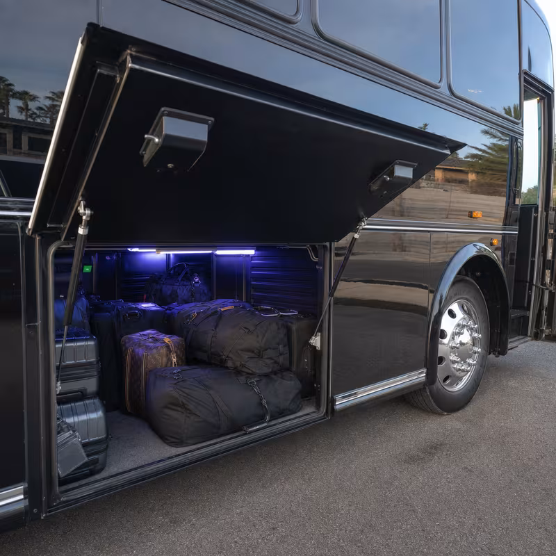 Party bus interior with wraparound leather seating and LED lighting in Omaha